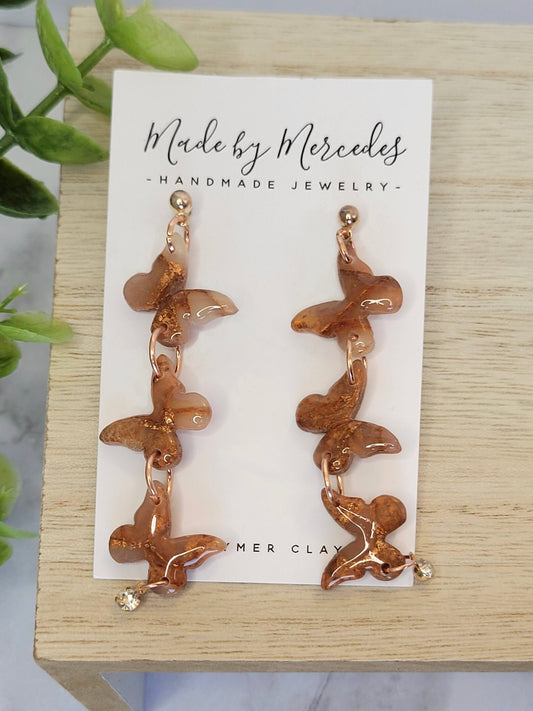 Bronze triple butterflies